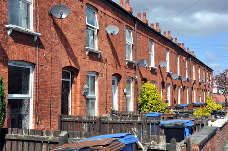 27549008 - row of traditional northern english red brick terraced houses